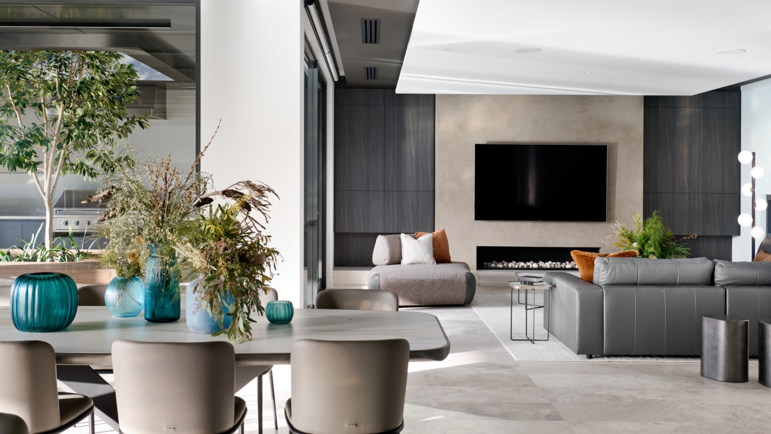 Modern living room interior with sofa and fireplace.