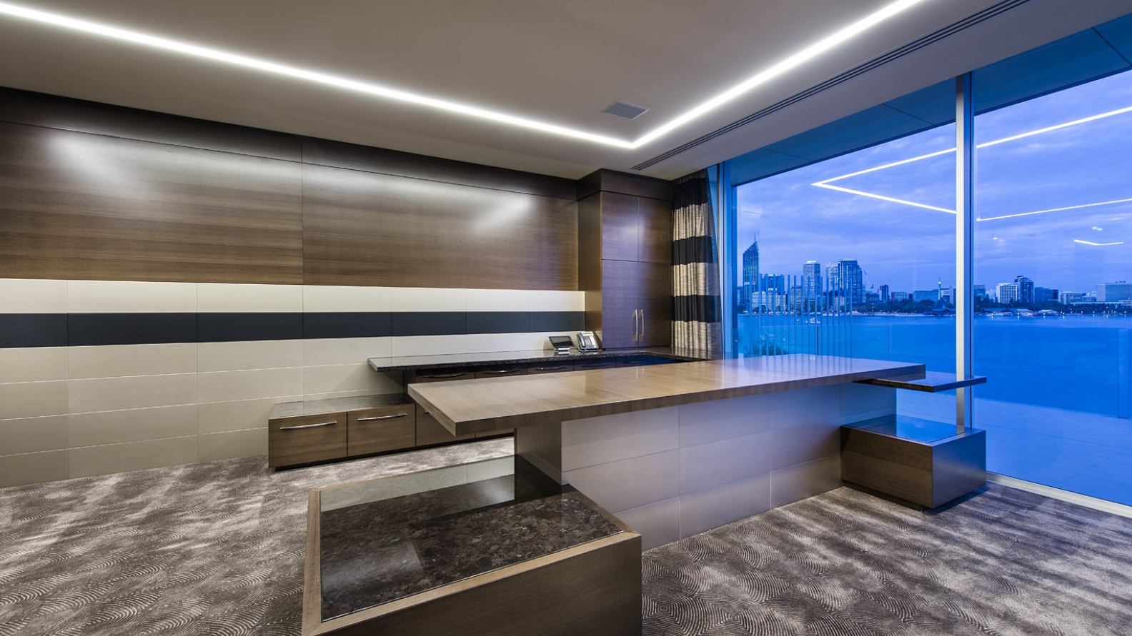 Modern office interior with city skyline view.
