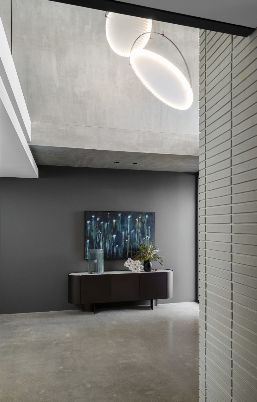Modern interior with artistic lighting and abstract painting.