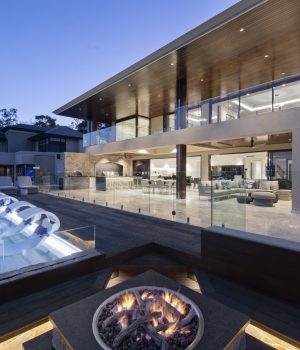 Modern luxury house with pool at dusk