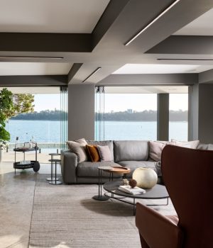 Modern living room interior with waterfront view.
